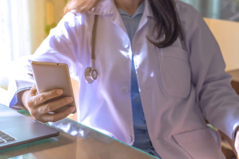 A doctor uses a phone for private communications